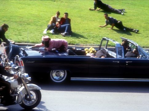Photo: The limousine carrying the mortally wounded President John F. Kennedy speeds through Dealey Plaza in Dallas, Nov. 22, 1963, as onlookers react in horror.