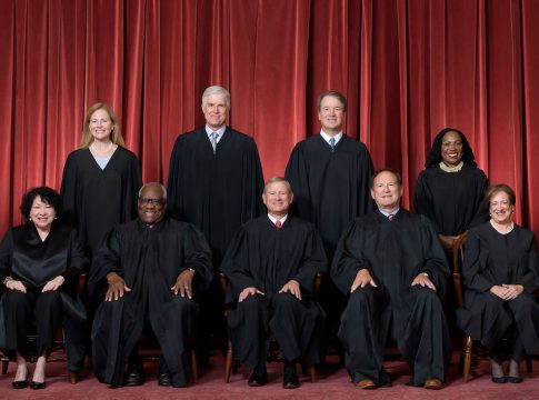 Formal group photograph of the Supreme Court as it was been comprised on June 30, 2022 after Justice Ketanji Brown Jackson joined the Court. The Justices are posed in front of red velvet drapes and arranged by seniority, with five seated and four standing.
Seated from left are Justices Sonia Sotomayor, Clarence Thomas, Chief Justice John G. Roberts, Jr., and Justices Samuel A. Alito and Elena Kagan.
Standing from left are Justices Amy Coney Barrett, Neil M. Gorsuch, Brett M. Kavanaugh, and Ketanji Brown Jackson.
Credit: Fred Schilling, Collection of the Supreme Court of the United States