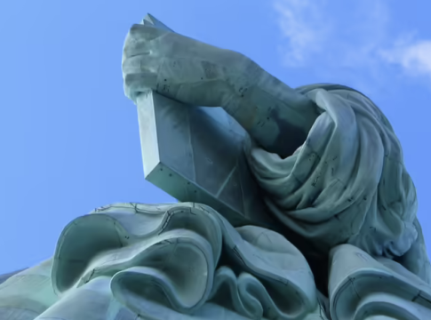 America's Statue of Liberty, holding a tablet in her left hand which has the date of the Declaration of Independence -- July 4, 1776 -- inscribed in Roman numerals. This boldly represents the laws and principles of American independence.