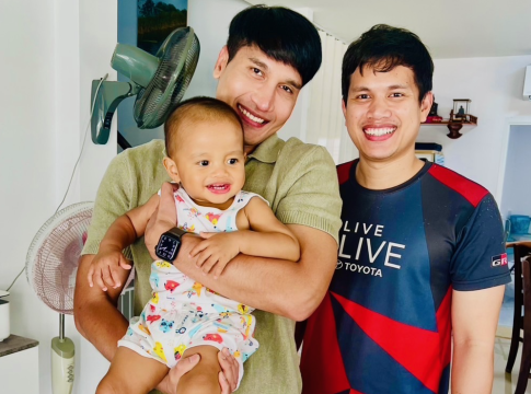 Thai American uncle gets to hold his favorite nephew during a visit with his brother and sister-in-law in Bangkok. Photo credit: Jonathan "Bix" Luce.