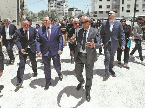 Members of a diplomatic delegation from the European Union walk near the eastern entrance of Jenin camp during a visit to the city of Jenin, on May 21, 2025, amid an ongoing Israeli military offensive in the occupied West Bank. The Palestinian Authority accused Israeli forces of firing on diplomats as they visited the flashpoint West Bank city of Jenin on May 21, releasing video of two soldiers aiming rifles at a group of people.