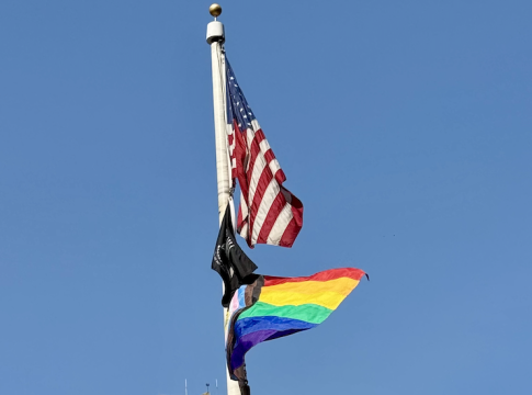 The rainbow flag flying proudly with the American flag on Roosevelt Island in New York City, June 2025. Photo credit: The Stewardship Report.