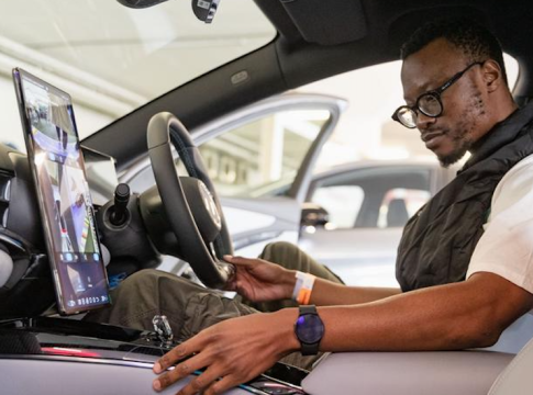 A visitor tries an electric vehicle of BYD from China during the Festival of Motoring in Johannesburg, South Africa, Aug. 30, 2024.