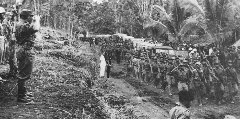 Saluting Permesta troops in North Sulawesi, Indonesia, 1959