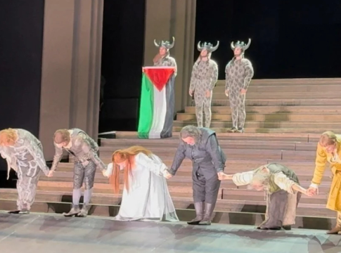 Cast members bow as one holds a Palestinian flag, during the curtain call of Il Trovatore at the Royal Opera House in Covent Garden, London, Britain on Sunday. The incident comes after numerous artists offered messages of support for people in Gaza at this year’s Glastonbury festival. Photo credit: @sydcas.