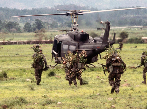Salvadoran soldiers run to board UH-1 Iroquois helicopters from the 227th Aviation Battalion, 1st Cavalry Division, during Exercise GRANADERO I.